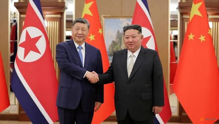 Xi Jinping bersama Kim Jong Un
