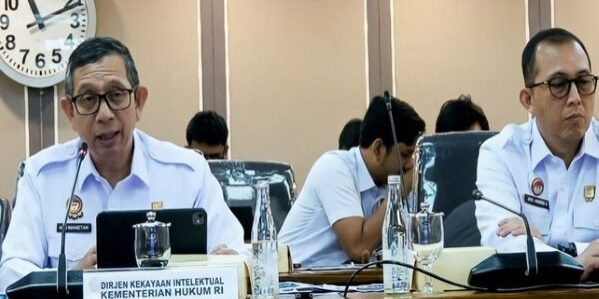 Direktur Jenderal Kekayaan Intelektual Kementerian Hukum, Hermansyah Siregar (kiri) saat RDP dengan Komisi XIII DPR RI. (Foto: Tangkapan layar youtube)